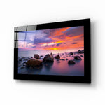 Sunset glass wall art displayed above a sideboard in a study