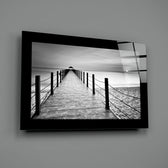 Editorial-photo panel bringing monochrome calm to a coastal cottage