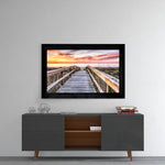 Sunset glass wall art styled above a console in a meditation room