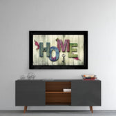 Home glass wall art styled above a sideboard in a reading nook