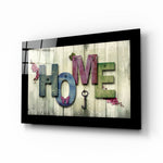Home glass wall art displayed above a console in an entryway