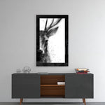 Deer glass wall art styled above a console in a reading nook