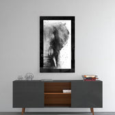 Elephant glass wall art styled above a console in a reading nook
