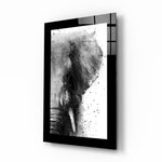 Elephant glass wall art displayed above a sideboard in a study