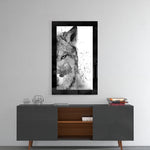Wolf glass wall art styled above a console in a reading nook