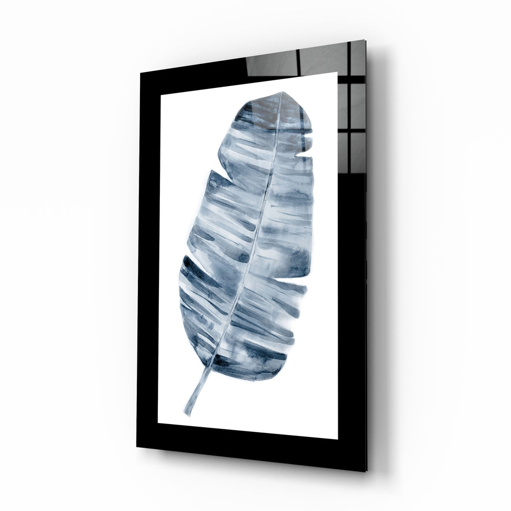 Leaf glass wall art displayed above a bed in a bedroom