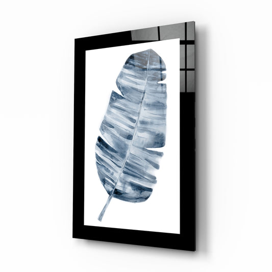 Leaf glass wall art displayed above a bed in a bedroom