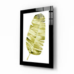 Leaf glass wall art displayed above a bed in a bedroom