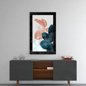 Leaves glass wall art styled above a console in a reading nook