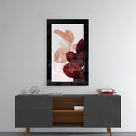 Leaves glass wall art styled above a console in a reading nook