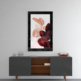 Leaves glass wall art styled above a console in a reading nook